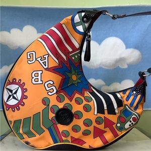Y2K vibrant shoulder bag with bold graphics. Unique design with mix of color new